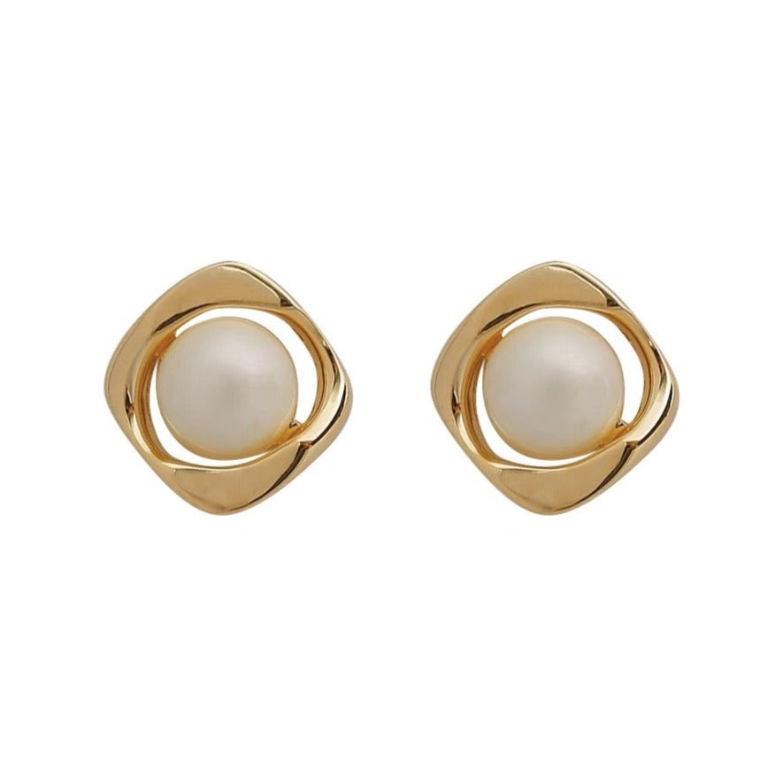 Delicate and Opulent pearl stud earrings