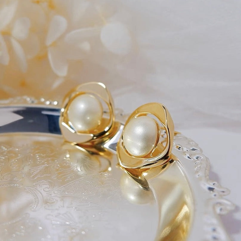 Delicate and Opulent pearl stud earrings