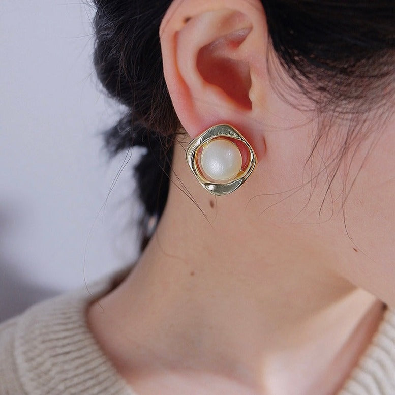 Delicate and Opulent pearl stud earrings